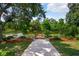 This backyard features a wooden dock and beautiful lake views at 4267 Adelaide Ave, North Port, FL 34288