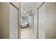 Hallway view of a luxurious bathroom with a freestanding tub at 4267 Adelaide Ave, North Port, FL 34288
