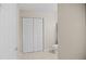 A clean, neutral-toned bathroom features a large closet and toilet at 4267 Adelaide Ave, North Port, FL 34288