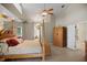 Large main bedroom with four-poster bed, ceiling fan, and bathroom access at 4267 Adelaide Ave, North Port, FL 34288