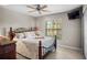 Comfortable bedroom features a large window, ceiling fan, and decorative furniture at 4267 Adelaide Ave, North Port, FL 34288