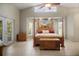 Main bedroom featuring an ornate four-poster bed and ample natural light at 4267 Adelaide Ave, North Port, FL 34288