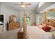 Spacious main bedroom includes a four-poster bed and deck access at 4267 Adelaide Ave, North Port, FL 34288