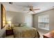 Comfortable bedroom features a ceiling fan, and a nice window view at 4267 Adelaide Ave, North Port, FL 34288