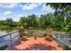 Beautiful deck overlooking a serene pond, perfect for relaxing and enjoying nature at 4267 Adelaide Ave, North Port, FL 34288