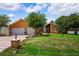 Attractive home with a well-kept lawn, mature landscaping and a two-car garage at 4267 Adelaide Ave, North Port, FL 34288