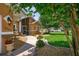 Inviting home exterior featuring a walkway, fountains, and lush landscaping at 4267 Adelaide Ave, North Port, FL 34288