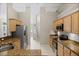 A view from the kitchen highlights stainless steel appliances and tiled floors at 4267 Adelaide Ave, North Port, FL 34288