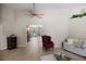 Spacious living room with high ceilings, comfortable seating, and view to front entry at 4267 Adelaide Ave, North Port, FL 34288