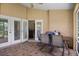 The covered patio offers a grill and comfortable seating, ideal for outdoor dining at 4267 Adelaide Ave, North Port, FL 34288