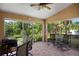 The covered patio offers views of the lush backyard landscaping and waterfront at 4267 Adelaide Ave, North Port, FL 34288