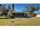 Screened back patio with bird bath and grassy area at 514 Orlando Blvd, Port Charlotte, FL 33954