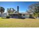 Screened back patio with access from inside the home at 514 Orlando Blvd, Port Charlotte, FL 33954