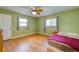 Bright bedroom with wood floors and ceiling fan at 514 Orlando Blvd, Port Charlotte, FL 33954
