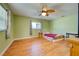 Bedroom with wood floors and ceiling fan at 514 Orlando Blvd, Port Charlotte, FL 33954