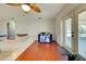 Dining area with wood flooring, ceiling fan, and view into living room at 514 Orlando Blvd, Port Charlotte, FL 33954