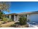 Front view of a charming one-story house with a well-maintained lawn at 514 Orlando Blvd, Port Charlotte, FL 33954