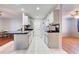 Galley style kitchen with white cabinets and granite counters at 514 Orlando Blvd, Port Charlotte, FL 33954