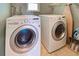 Laundry room with LG washer and dryer, and ironing board at 514 Orlando Blvd, Port Charlotte, FL 33954