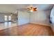 Open living room with wood floors and view of kitchen at 514 Orlando Blvd, Port Charlotte, FL 33954