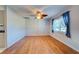 Living room with wood floor, ceiling fan, and window at 514 Orlando Blvd, Port Charlotte, FL 33954