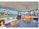 Relaxing screened porch with seating and a dining area at 514 Orlando Blvd, Port Charlotte, FL 33954