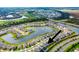 Aerial view showcasing home's location in a community by a lake at 5274 Grove Mill Loop, Bradenton, FL 34211