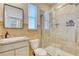 Bathroom with walk-in shower, toilet and sink at 5274 Grove Mill Loop, Bradenton, FL 34211