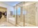 Bathroom with walk-in shower and soaking tub at 5274 Grove Mill Loop, Bradenton, FL 34211