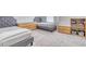 Two twin beds, dresser, and shelving in a well-lit bedroom at 5274 Grove Mill Loop, Bradenton, FL 34211