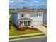 Two-story house with gray siding, landscaping, and a two-car garage at 5274 Grove Mill Loop, Bradenton, FL 34211