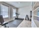 Home gym with treadmill, weights, and bench at 5274 Grove Mill Loop, Bradenton, FL 34211