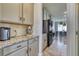 Kitchen with granite countertops and built-in appliances at 5274 Grove Mill Loop, Bradenton, FL 34211