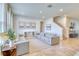 Bright living room featuring two sofas and large windows at 5274 Grove Mill Loop, Bradenton, FL 34211