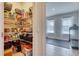 Walk-in pantry with ample shelving and home gym visible at 5274 Grove Mill Loop, Bradenton, FL 34211