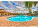 Resort-style community pool with plenty of lounge chairs at 5274 Grove Mill Loop, Bradenton, FL 34211