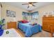 Cozy bedroom with dresser and a full-size bed at 716 Mirado Nw Ln, Port Charlotte, FL 33948