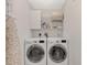 Bright laundry room with washer, dryer, and ample storage at 7849 Franzino Ave, North Port, FL 34291