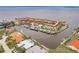 Aerial view of a waterfront complex with boat docks, harbor, and red roofs at 1 Colony Point Dr # A19, Punta Gorda, FL 33950