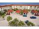 Aerial view of condo building with parking and waterfront access at 1 Colony Point Dr # A19, Punta Gorda, FL 33950