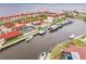 Aerial view of a waterfront complex with boat docks and screened pool at 1 Colony Point Dr # A19, Punta Gorda, FL 33950