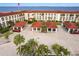 Overhead view of condo parking, palm trees and landscaping near building entrance at 1 Colony Point Dr # A19, Punta Gorda, FL 33950