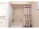 Bathroom with shower/tub combo and palm tree shower curtain at 1 Colony Point Dr # A19, Punta Gorda, FL 33950