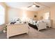 Guest bedroom with two twin beds, ceiling fan and dresser at 1 Colony Point Dr # A19, Punta Gorda, FL 33950