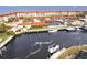 Waterfront view of boat docks, harbor, and complex with red roofs at 1 Colony Point Dr # A19, Punta Gorda, FL 33950