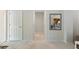 Bright hallway with mirror reflecting living room at 1029 Belmar Ave, Port Charlotte, FL 33948