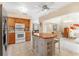 Open kitchen with view to living room and sunroom at 1029 Belmar Ave, Port Charlotte, FL 33948