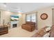 Relaxing living room with brown couches and a fireplace at 1029 Belmar Ave, Port Charlotte, FL 33948