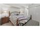 Serene main bedroom featuring a king-size bed and ensuite bathroom access at 1029 Belmar Ave, Port Charlotte, FL 33948