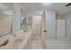 Bathroom with double vanity and shower at 103 Atwater St, Port Charlotte, FL 33954